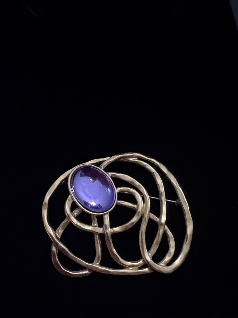 Elegant Gold Swirl Brooch with Purple Cabochon